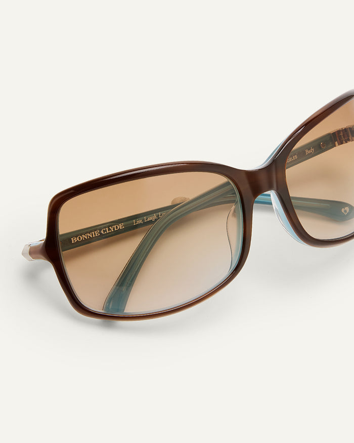 Additional view of Bonnie Clyde Body rounded square sunglasses in teal demi with brown lenses.