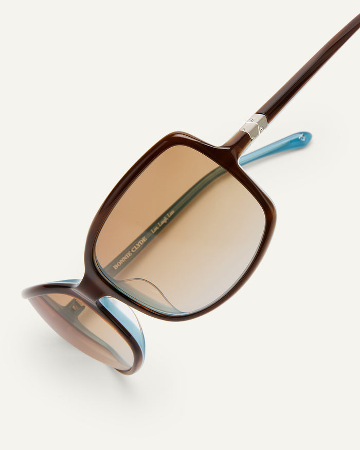Additional detail of Bonnie Clyde Body rounded square sunglasses in teal demi with brown lenses.