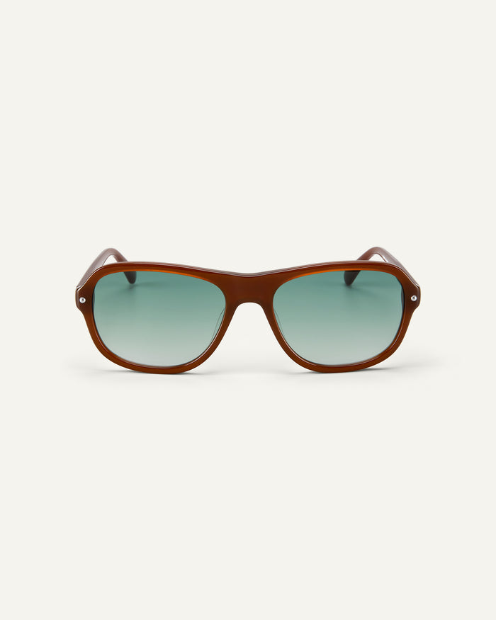 Face shot of Bonnie Clyde Boss Fight sunglasses in brown with green lenses.