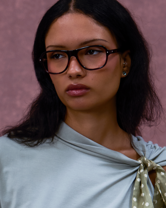 Quarter shot of Bonnie Clyde Boss Fight optical frames in red tortoise with clear lenses.