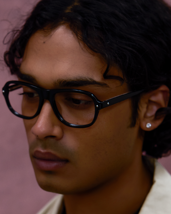 Quarter shot of Bonnie Clyde Boss Fight optical frames in black with clear lenses.