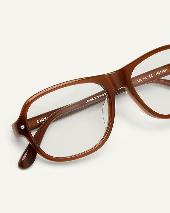Side shot of Bonnie Clyde Boss Fight optical frames in dark brown with clear lenses.