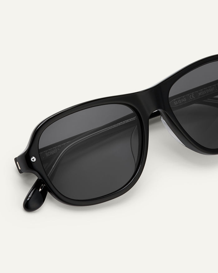 Close-up shot of Bonnie Clyde Boss Fight sunglasses in black with black lenses.