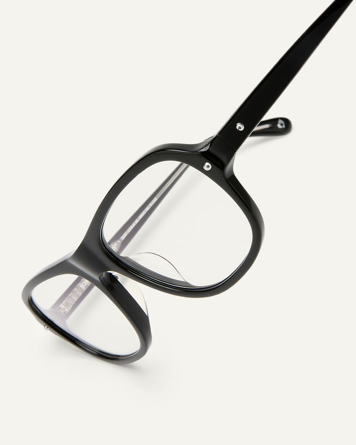 Close-up shot of Bonnie Clyde Boss Fight optical frames in black with clear lenses.