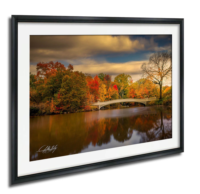 a serene autumn landscape with a calm river reflecting the vibrant colors of the trees lining its banks.