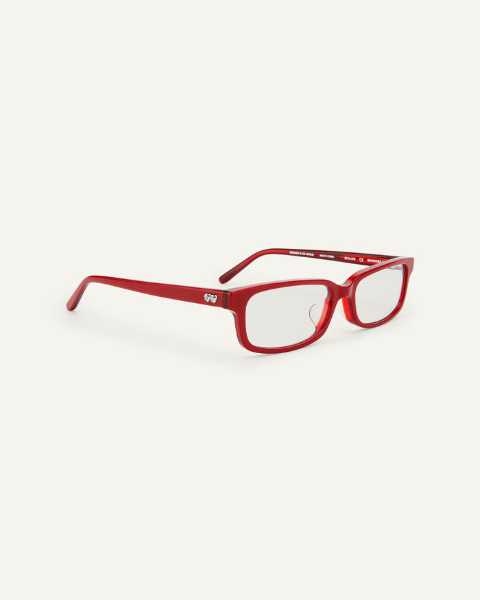 Quarter shot of Bonnie Clyde Boyfriend 2 optical frames in layered red with clear lenses.