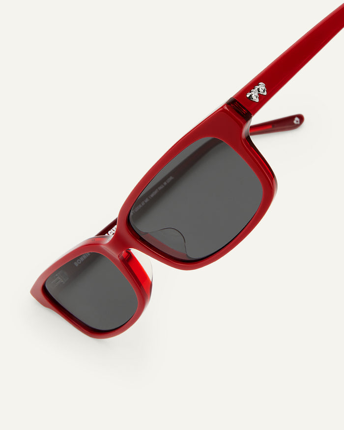 Side shot of Bonnie Clyde Boyfriend 2 sunglasses in layered red with black lenses.