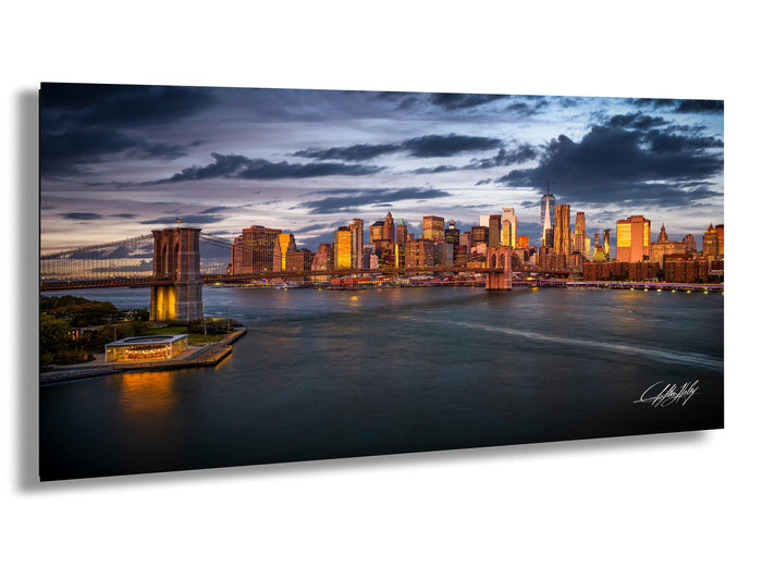 a stunning skyline of a city at dusk, with the city's skyscrapers and landmarks illuminated against a dramatic cloudy sky.