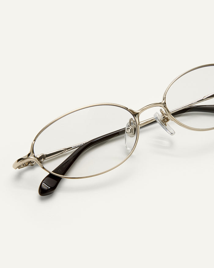 Close up shot of Bonnie Clyde Bunny optical frames in stainless steel silver and clear lens.