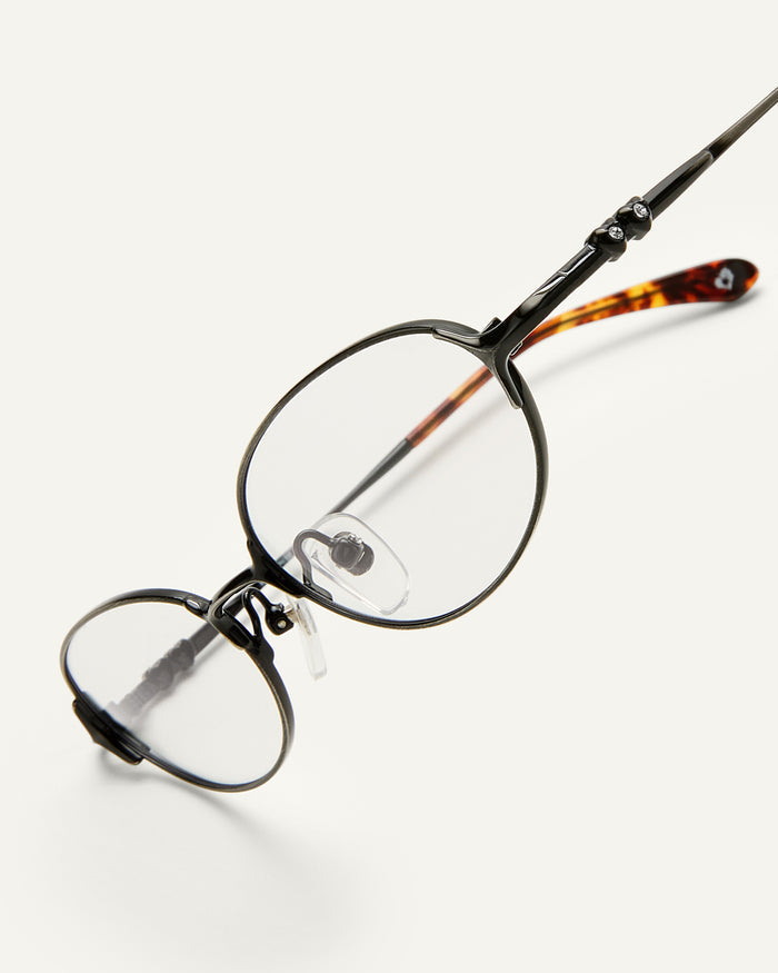 Side shot of Bonnie Clyde Bunny optical frames in black stainless steel and clear lens.