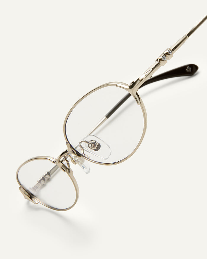 Side shot of Bonnie Clyde Bunny optical frames in stainless steel silver and clear lens.