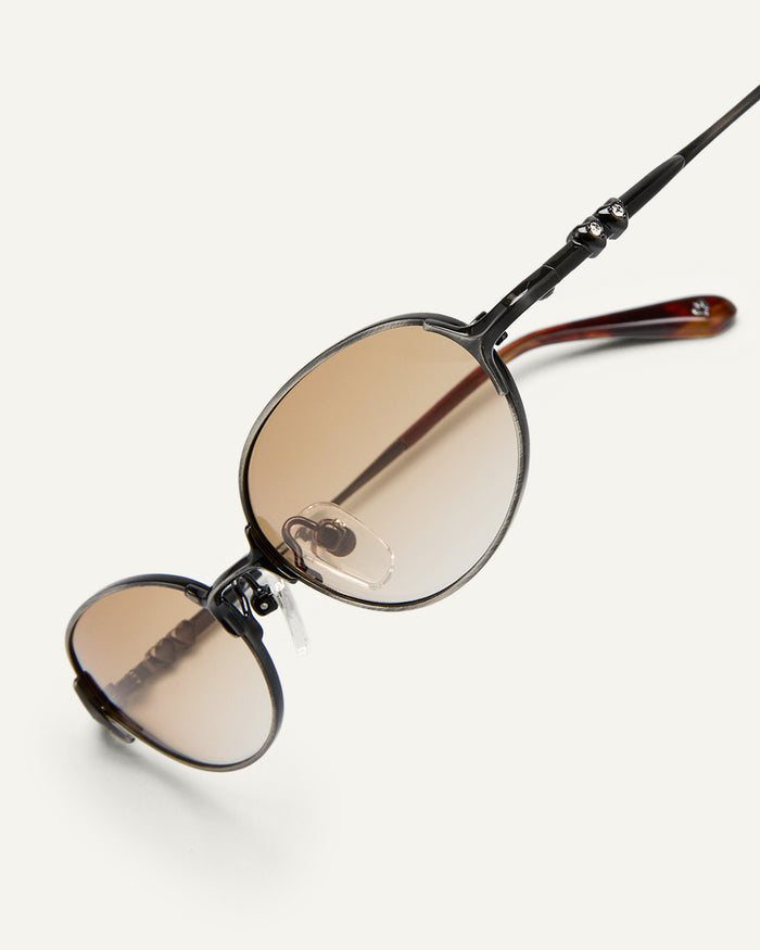 Side shot of Bonnie Clyde Bunny sunglasses in black titanium with brown gradient lenses.