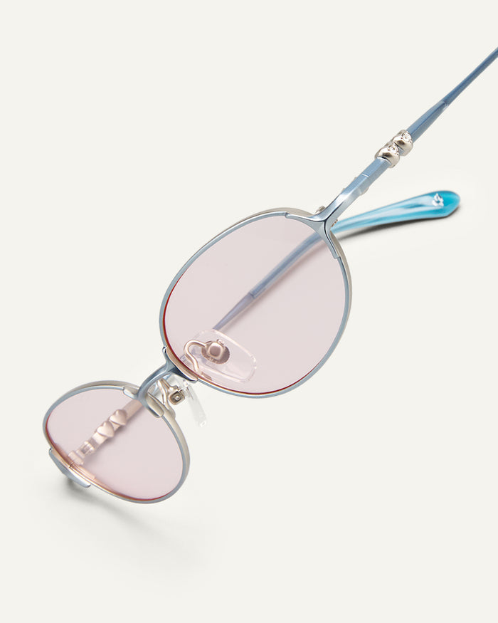 Side shot of Bonnie Clyde Bunny sunglasses in titanium silver and pink lenses.
