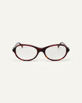 Face shot of Bonnie Clyde Butter Knife optical frames in red tortoise with clear lenses.