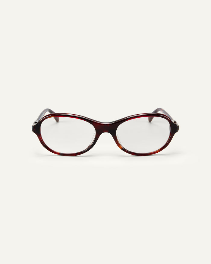 Face shot of Bonnie Clyde Butter Knife optical frames in red tortoise with clear lenses.