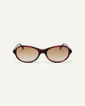 Face shot of Bonnie Clyde Butter Knife sunglasses in red tortoise with brown lenses.