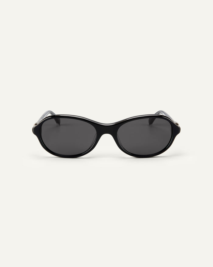 Face shot of Bonnie Clyde Butter Knife sunglasses in black with black lenses.