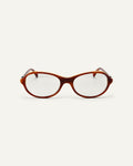 Face shot of Bonnie Clyde Butter Knife optical frames in layered brown with clear lenses.