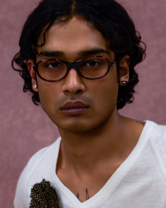 Quarter shot of Bonnie Clyde Butter Knife optical frames in red tortoise with clear lenses.