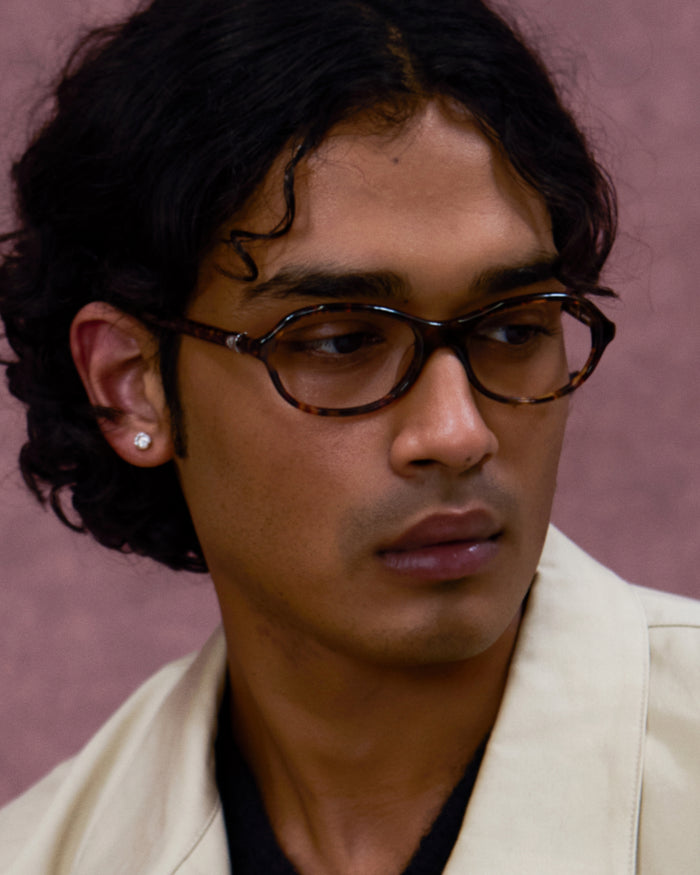 Quarter shot of Bonnie Clyde Butter Knife optical frames in tortoise with clear lenses.