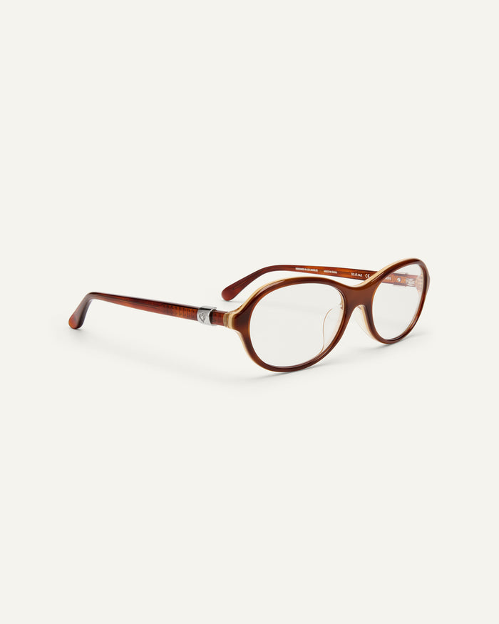 Side shot of Bonnie Clyde Butter Knife optical frames in layered brown with clear lenses.