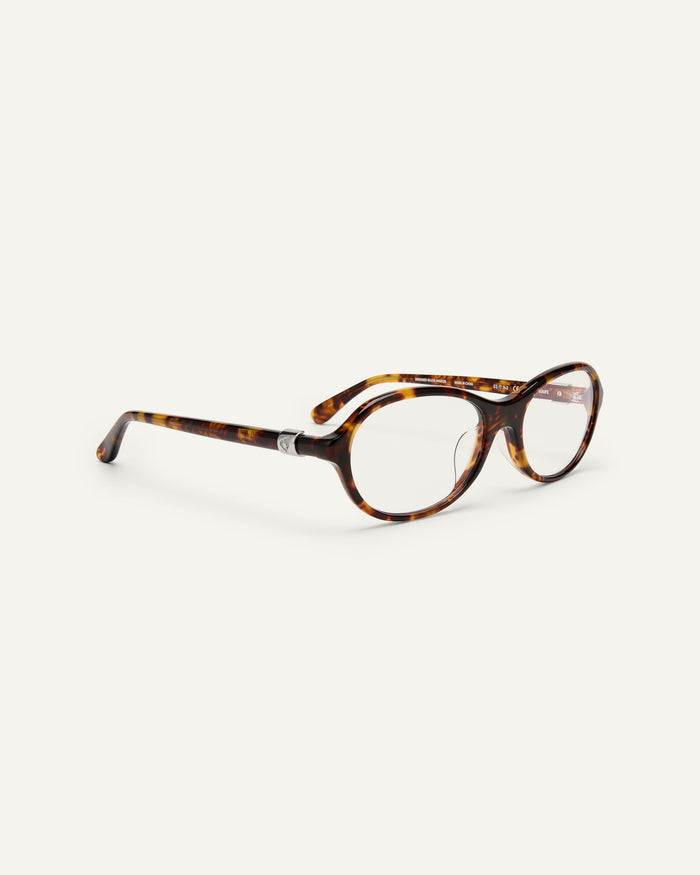Side shot of Bonnie Clyde Butter Knife optical frames in tortoise with clear lenses.
