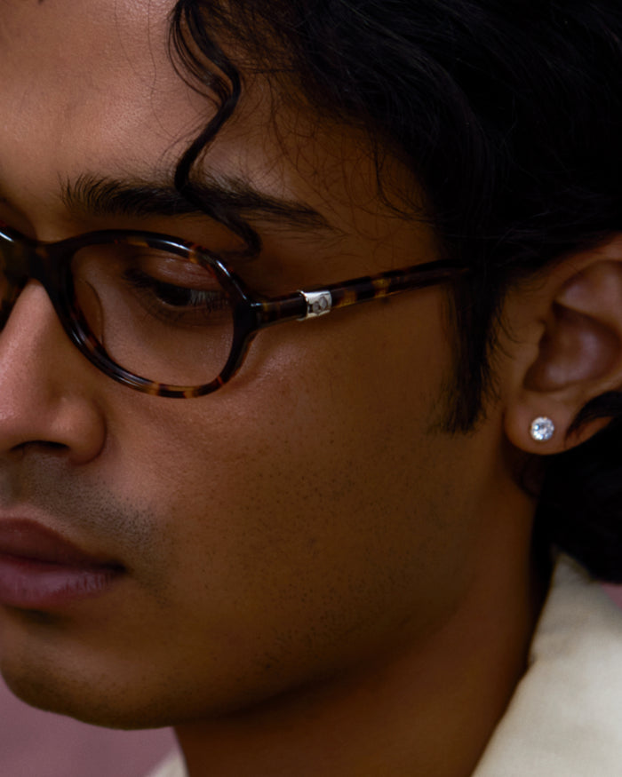 Close-up shot of Bonnie Clyde Butter Knife optical frames in tortoise with clear lenses.