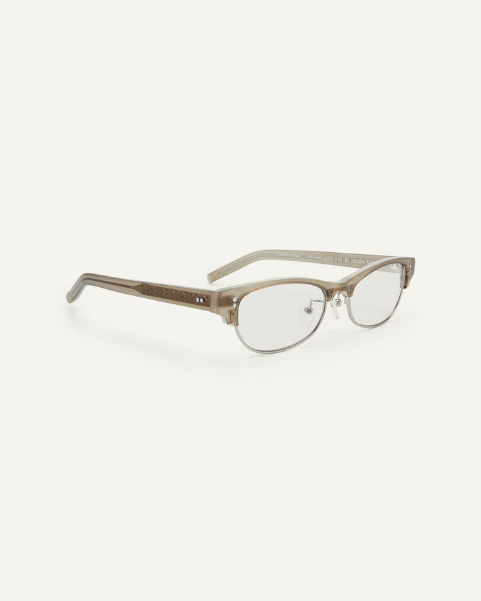 Quarter shot of Bonnie Clyde CC optical frames in grey with clear lenses.