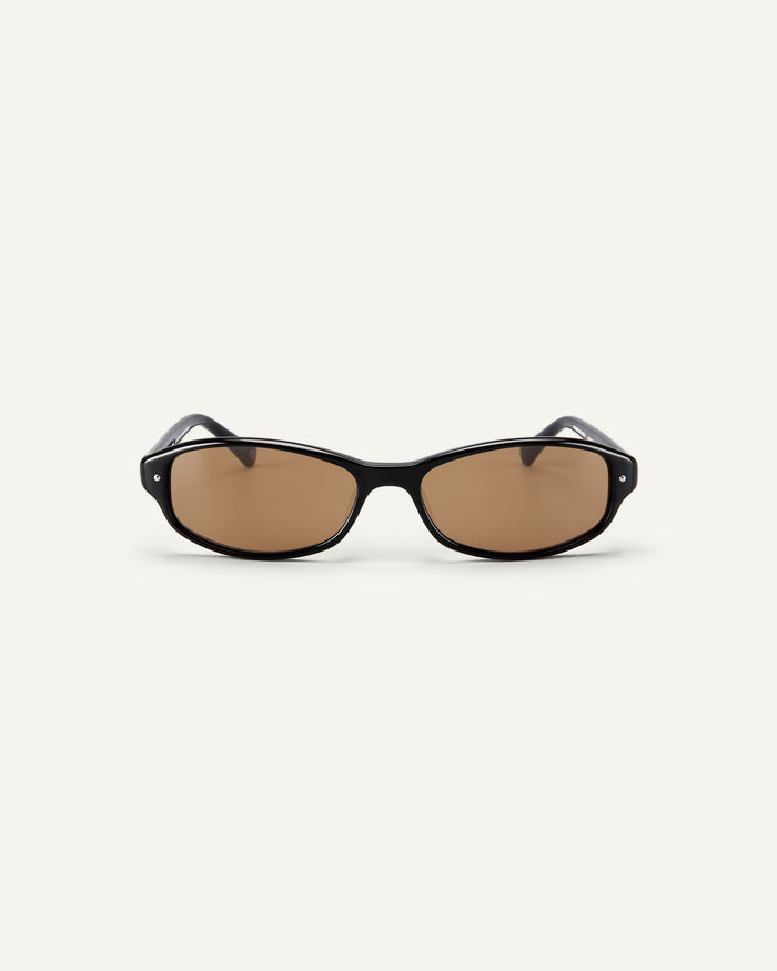 Face shot of Bonnie Clyde Coco sunglasses in black with brown lenses.