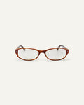 Face shot of Bonnie Clyde Coco optical frames in layered brown with clear lenses.