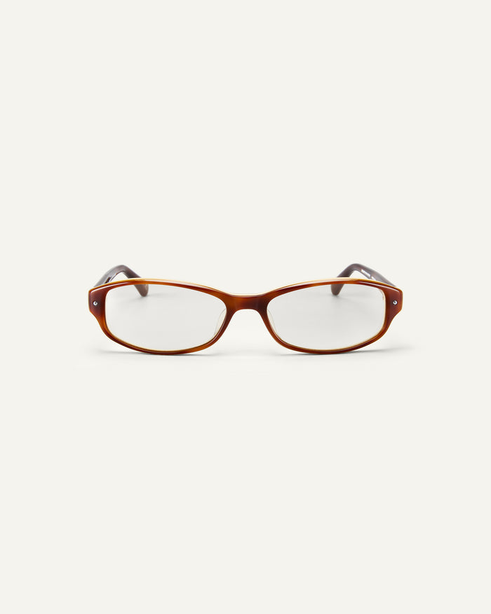 Face shot of Bonnie Clyde Coco optical frames in layered brown with clear lenses.