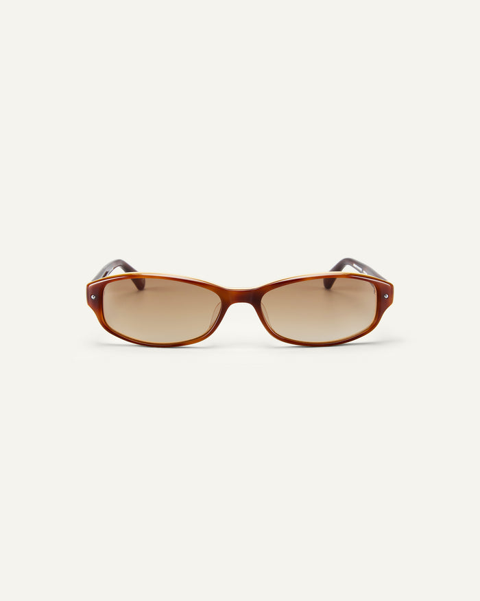 Face shot of Bonnie Clyde Coco sunglasses in layered brown with brown lenses.