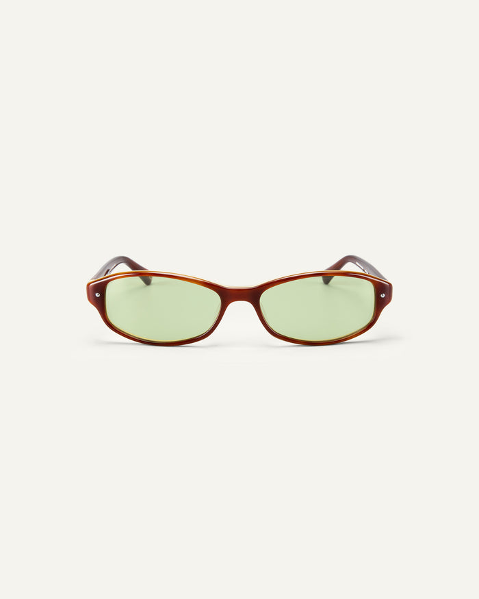 Face shot of Bonnie Clyde Coco sunglasses in layered brown with green lenses.