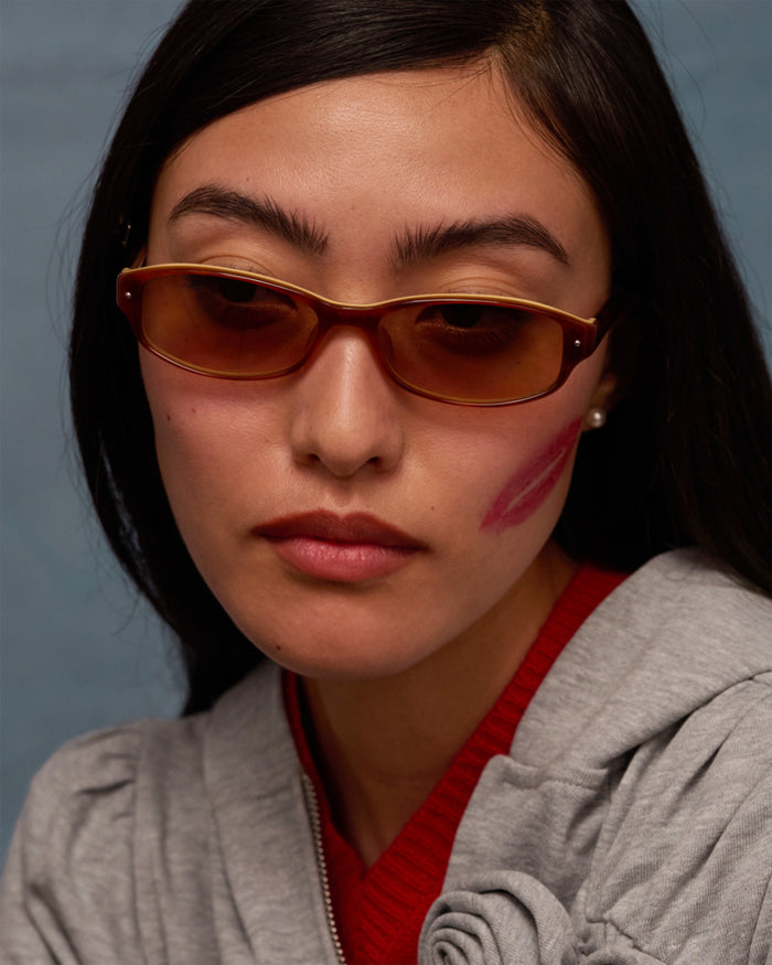 Quarter shot of Bonnie Clyde Coco sunglasses in layered brown with brown lenses.