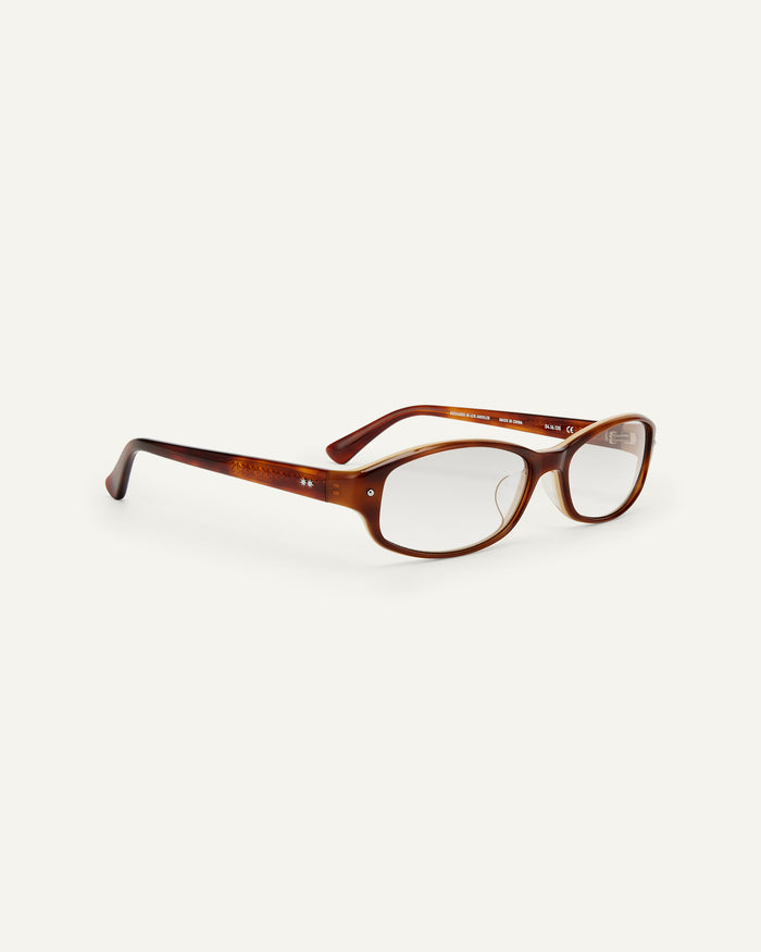 Quarter shot of Bonnie Clyde Coco optical frames in layered brown with clear lenses.