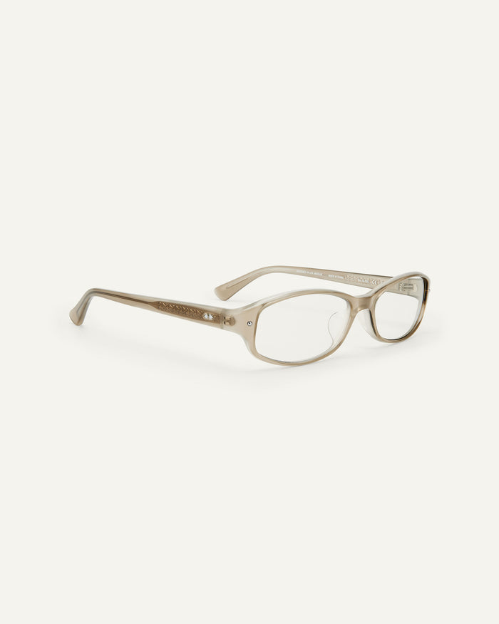 Quarter shot of Bonnie Clyde Coco optical frames in layered grey with clear lenses.