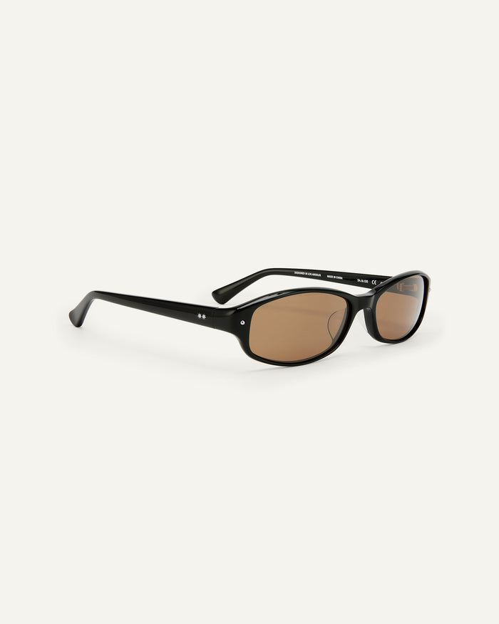 Side shot of Bonnie Clyde Coco sunglasses in black with brown lenses.