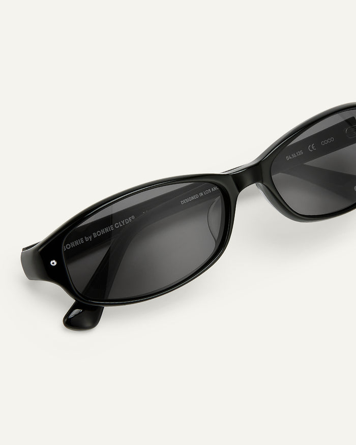 Side shot of Bonnie Clyde Coco sunglasses in black with black lenses.