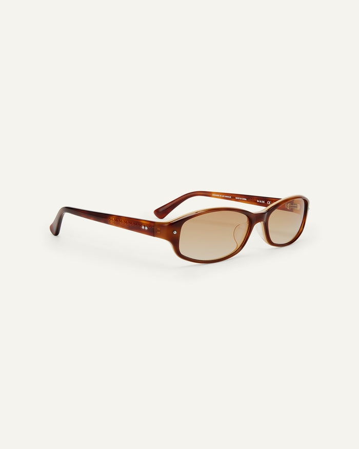 Side shot of Bonnie Clyde Coco sunglasses in layered brown with brown lenses.