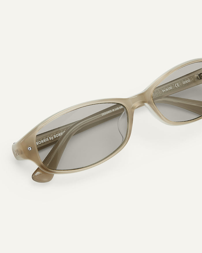 Close-up shot of Bonnie Clyde Coco sunglasses in grey with grey lenses.