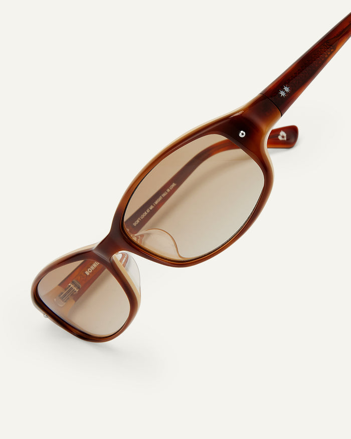 Close-up shot of Bonnie Clyde Coco sunglasses in layered brown with brown lenses.