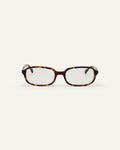 Face shot of Bonnie Clyde Comedy optical frames in tortoise with clear lenses.