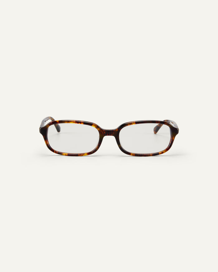 Face shot of Bonnie Clyde Comedy optical frames in tortoise with clear lenses.