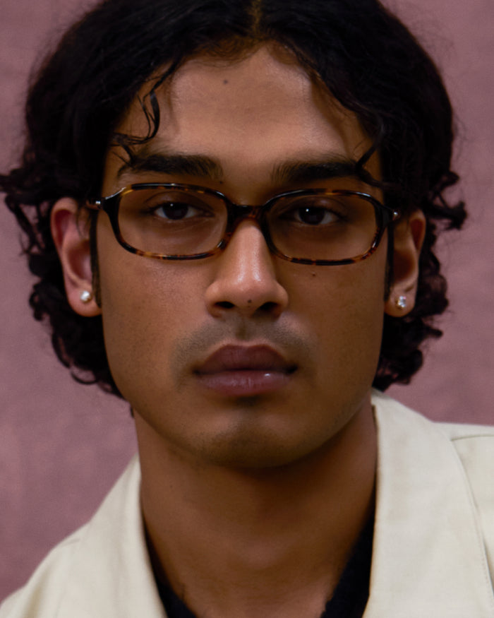 Quarter shot of Bonnie Clyde Comedy optical frames in tortoise with clear lenses.