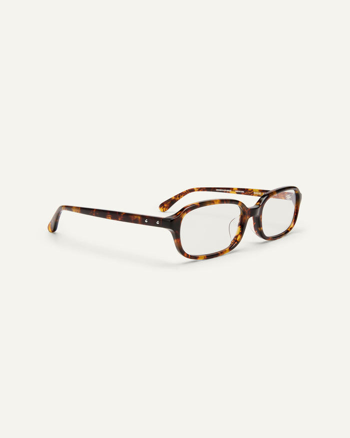 Side shot of Bonnie Clyde Comedy optical frames in tortoise with clear lenses.