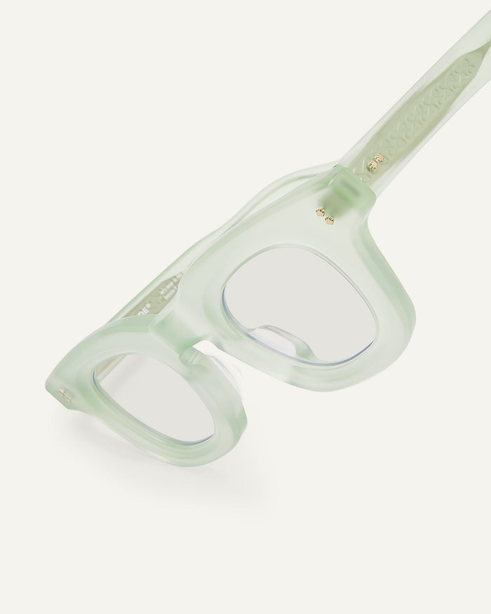 Close-up shot of Bonnie Clyde Crybaby optical frames in milky jade with clear lenses.