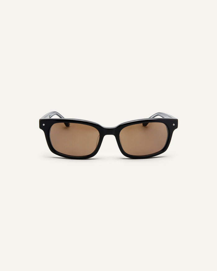 Face shot of Bonnie Clyde Dagger sunglasses in black with brown lenses.