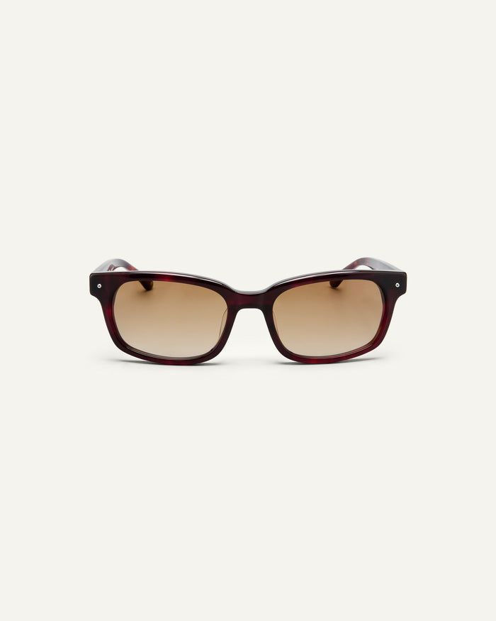 Face shot of Bonnie Clyde Dagger sunglasses in red tortoise with brown lenses.