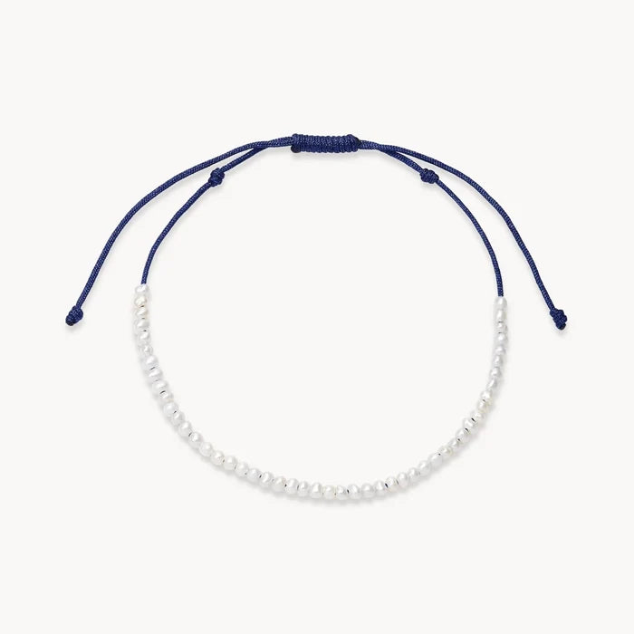dainty soft navy pearl anklet on white background