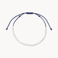 dainty soft navy pearl anklet on white background